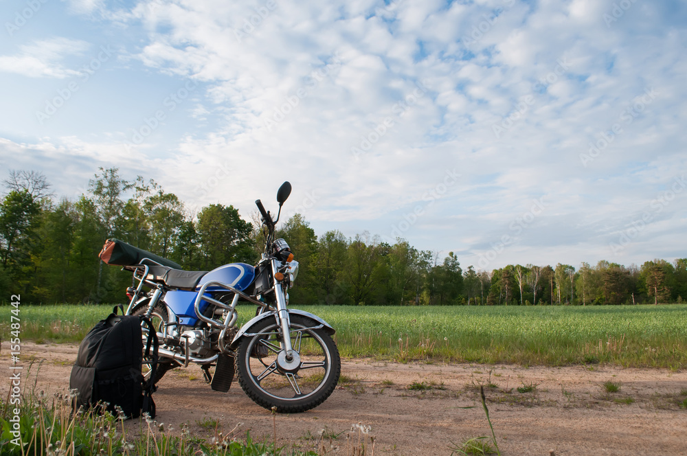 Naklejka premium Motorcycle on a background of sky and clouds,