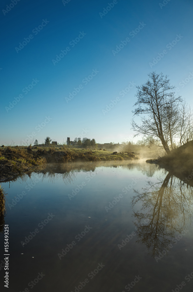 Morning mist on the river in spring, sunrise Morning mist on the river in spring, sunrise