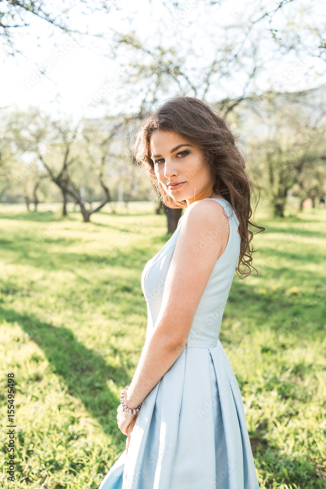 Portrait of a beautiful girl in a park in summer Portrait of a beautiful girl in a park in summer