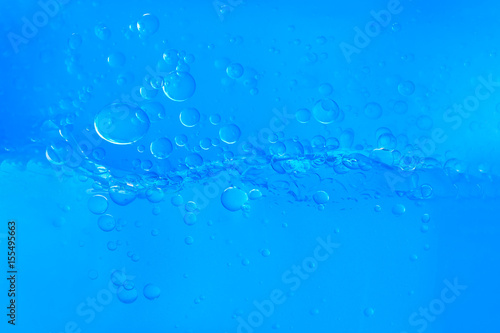 Blue water with bubbles on white background