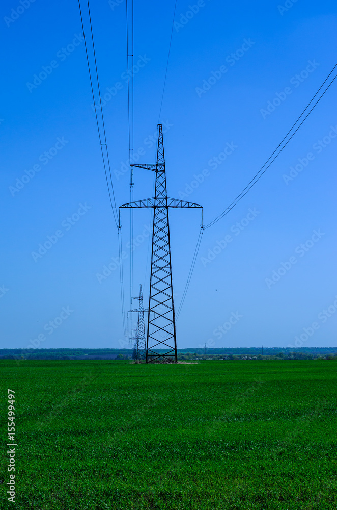 High voltage power line against sky
