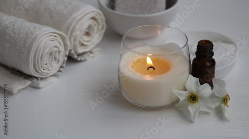 Burning candle on a spa setting