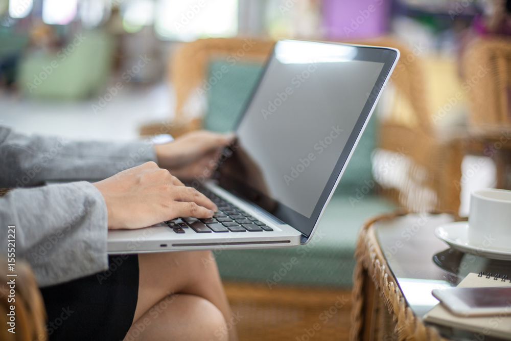 Close up of business woman hands typing on laptop computer in the office. Close up of business woman hands typing on laptop computer in the office.