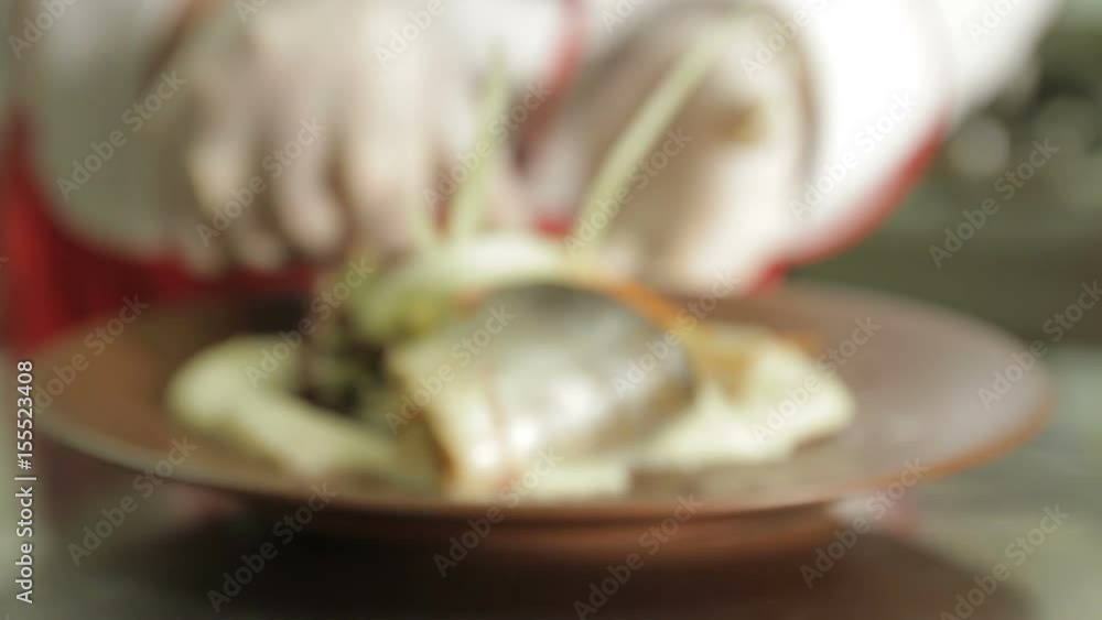 chef demonstrates Fish and mashed potatoes, background chef demonstrates Fish and mashed potatoes, background