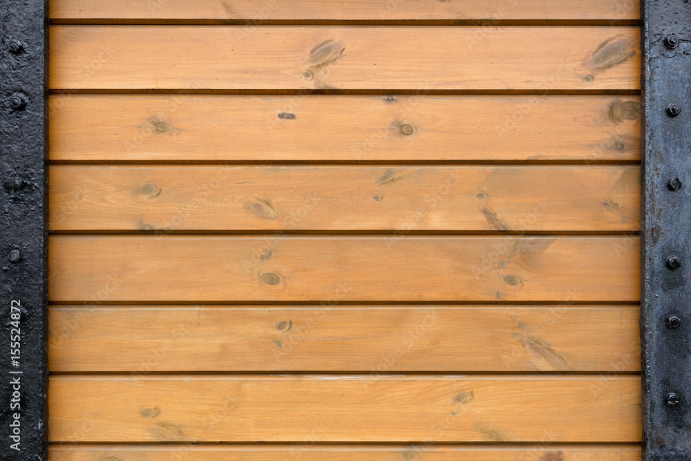 Boards screwed to steel plates. Metal and wood texture. Boards screwed to steel plates. Metal and wood texture.