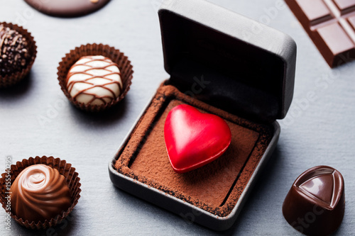 Heart shaped chocolate candy in a gift box.