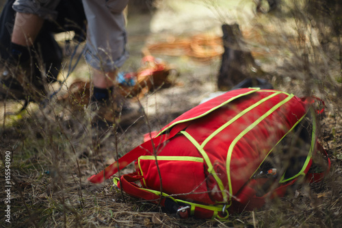 Packed backpack with parachute for BASE jumping is ready for use. Tilt-shift effect. photo