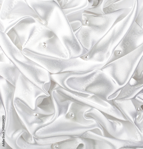 background of white brocade and silvet satin with pearl and waves tissue occupying the entire surface of the background