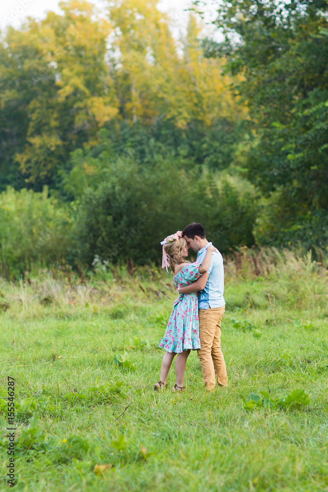 beautiful young couple hugging in the park beautiful young couple hugging in the park