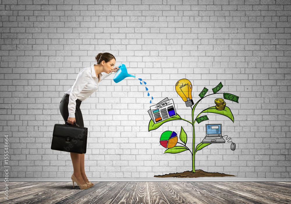 Young businesswoman in empty room watering drawn growth concept with can Young businesswoman in empty room watering drawn growth concept with can