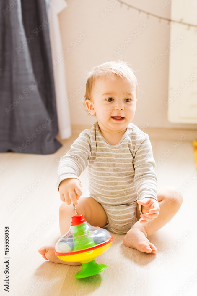 child boy toddler playing with toy indoors child boy toddler playing with toy indoors