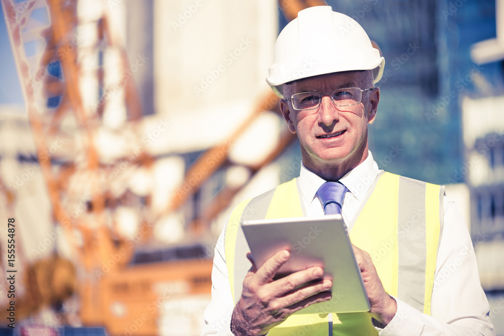 Construction manager controlling building site and tablet device Construction manager controlling building site and tablet device