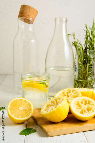 Squeezed lemons, water, mint and ready lemonade