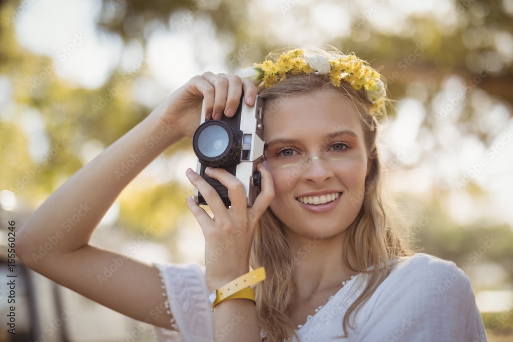 Portrait of smiling woman holding camera Portrait of smiling woman holding camera