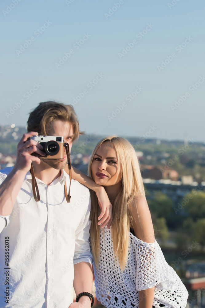 man looking through camera with pretty girl man looking through camera with pretty girl