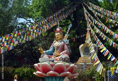 Statue and prayer flags in Swayambhu Swayambhunath Temple photo