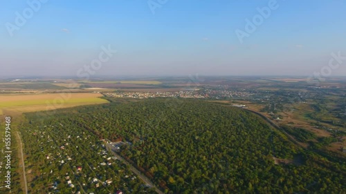 Aerial view of the field, road and houses in the Dnepr city, Ukraine. 4K, Ultra HD video.