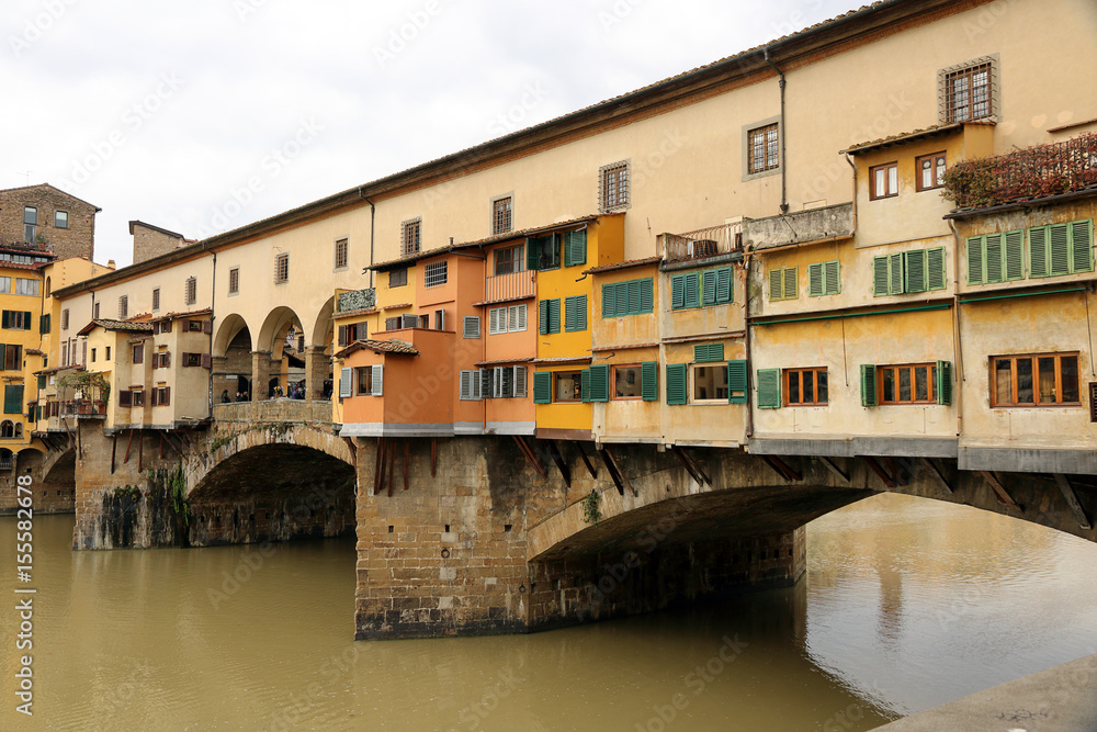 Shops on the Ponte Vecchio (old bridge)over the River Arno seen from the Ufizzi, in Florence, Italy