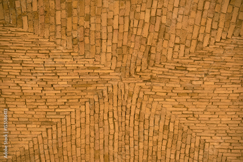 Fragment of the vaulted brick ceiling. Texture, background