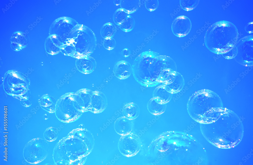 Soap bubbles with blue background