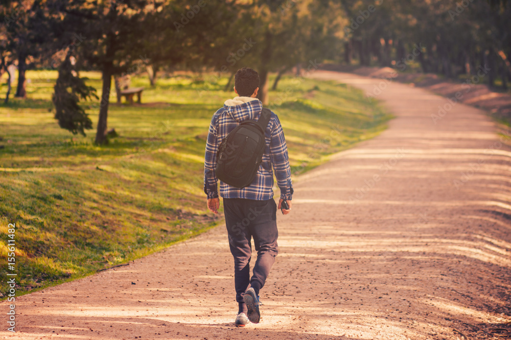 Fototapeta premium man walking on the park