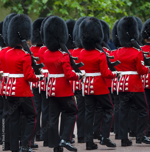 Photos Soldiers in classic red coats and bear fur busby headwear march along The Mall in London, England in a grand Trooping the Colour spectacle of the Queen's Royal Guard