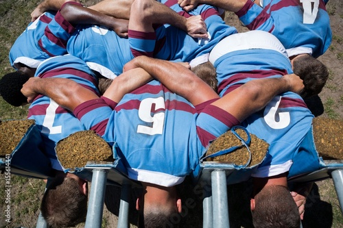 Overhead view of rugby players making huddle
