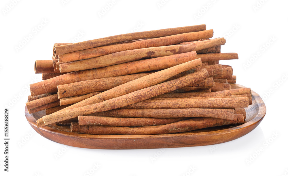 Cinnamon in basket on white background