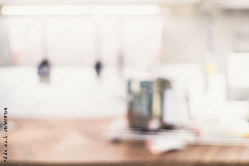 Blur abstract background of housewares on countertop in kitchen with bokeh light