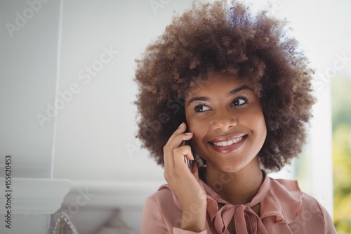 Happy woman talking on mobile phone