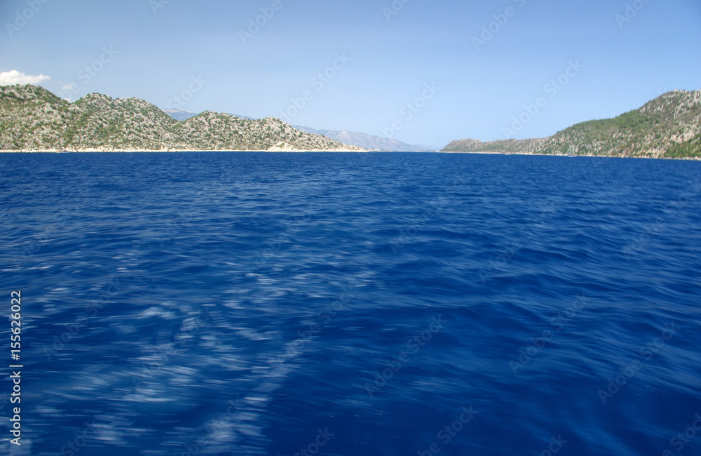 A quiet bay on the background of mountains and sea.View of the Mediterranean Sea and the mountains, Turkey/Beautiful water of Mediterranean Sea off the Turkish coast