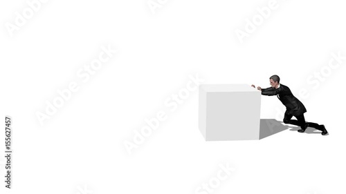 Businessman pushing a heavy box
