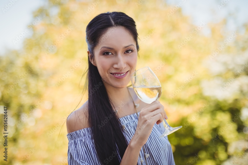 Young woman having a glass of wine Young woman having a glass of wine