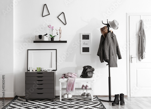 Fotografie Modern hall interior with hanging clothes