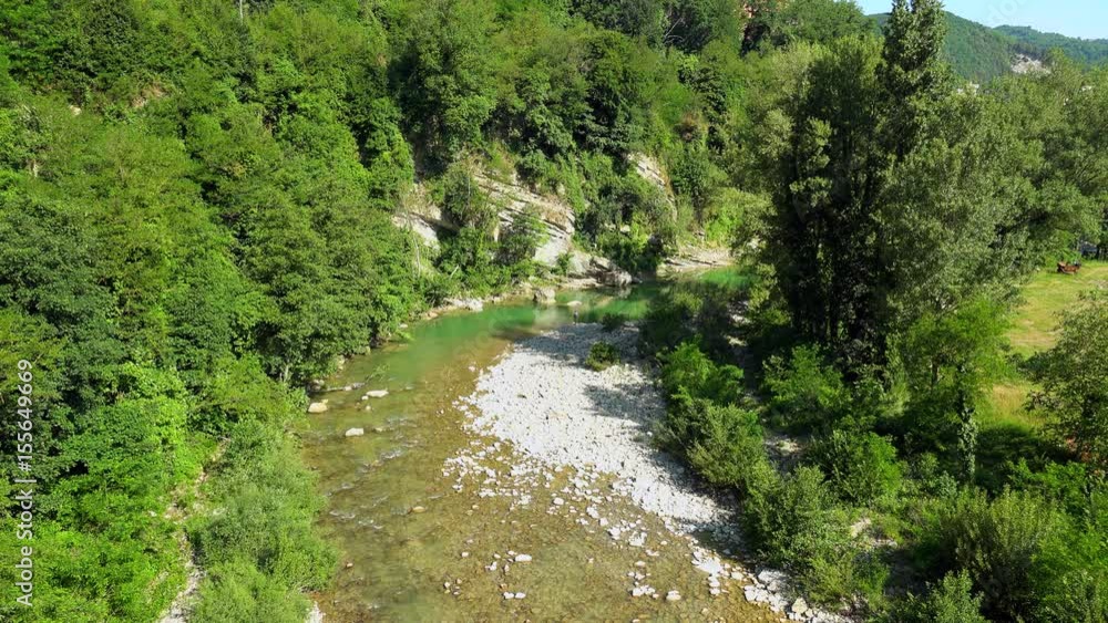 branch of green river in Italian countryside branch of green river in Italian countryside