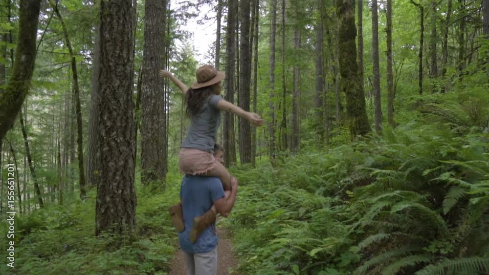 Man Gives Girlfriend A Shoulder Ride Through The Forest, He Twirls Her Around In Circle Man Gives Girlfriend A Shoulder Ride Through The Forest, He Twirls Her Around In Circle