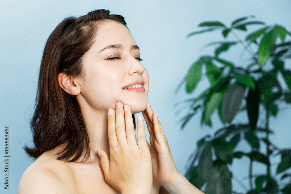 beautiful woman massaging her face. lymphatic massage. beautiful woman massaging her face. lymphatic massage.