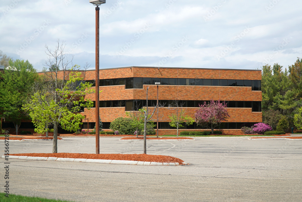 Obraz premium company buildings and empty parking lot