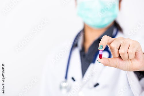 doctor holding colorful medical drug