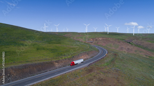Windy road with semi-truck and trailer driving