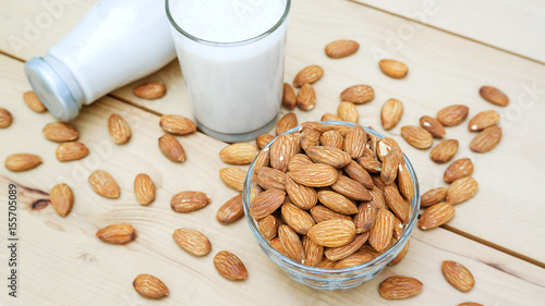 Almond milk on a wooden table.