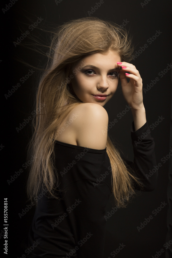 Tender young blonde model with long lush hair at studio Tender young blonde model with long lush hair at studio