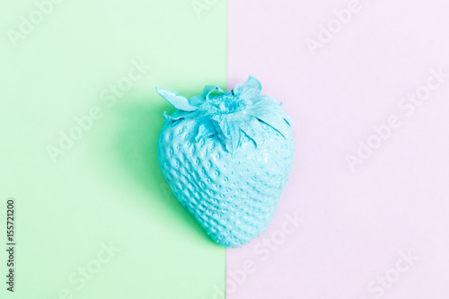 Painted strawberry on bright background
