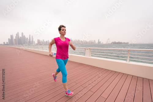 woman running on the promenade © .shock