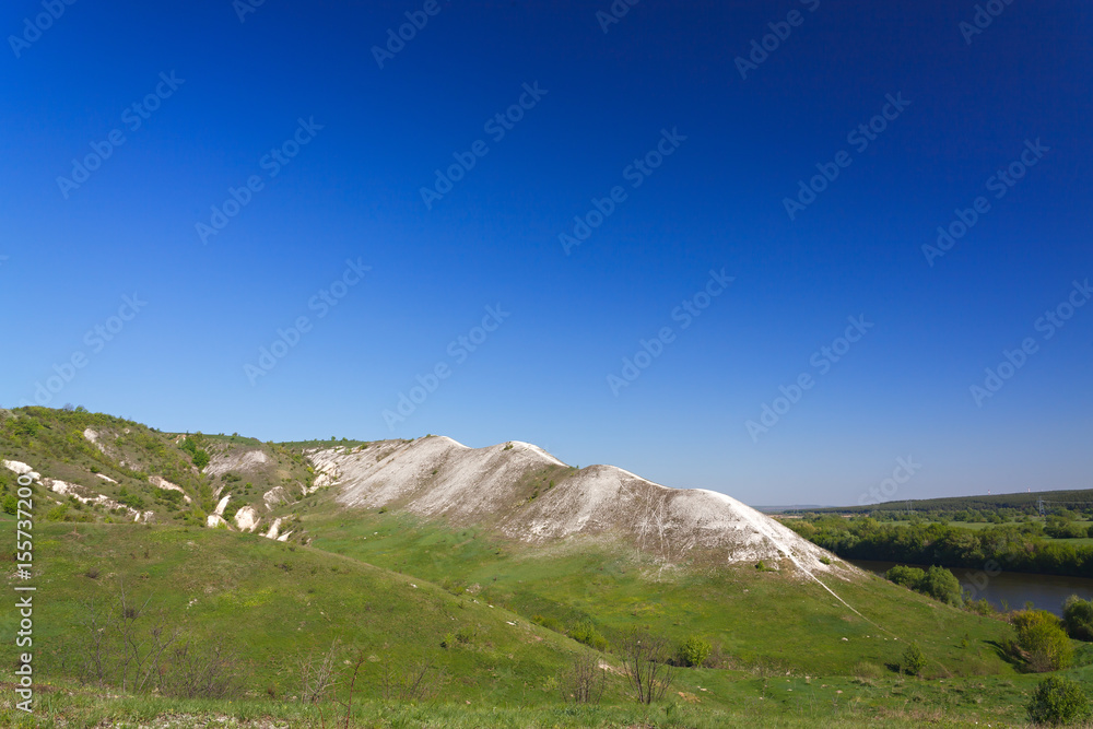 Ancient chalk mountains in central Russia. A landscape view of the peaks and hills.