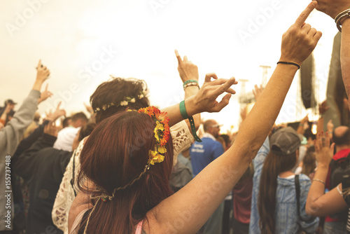 Lady with Flower Headdress Parties with Concert Crowd