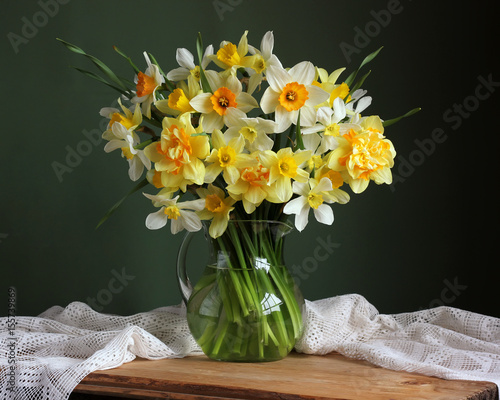 Yellow daffodils in a jug.