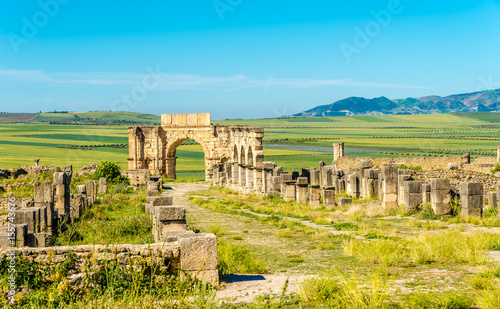 View at the street Decumanus Maximus in ruins of ancient city Volubilis - Morocco photo
