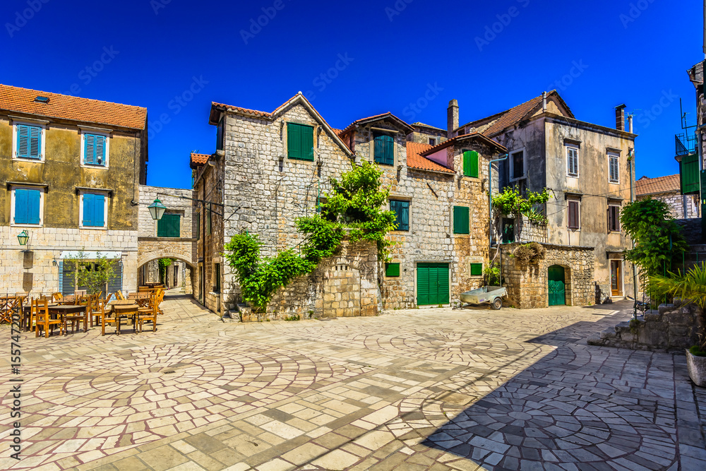 Naklejka premium Hvar architecture square. / Old stone architecture in town Starigrad, Island Hvar scenery.