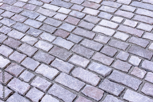 The paving stones lie diagonally, the background